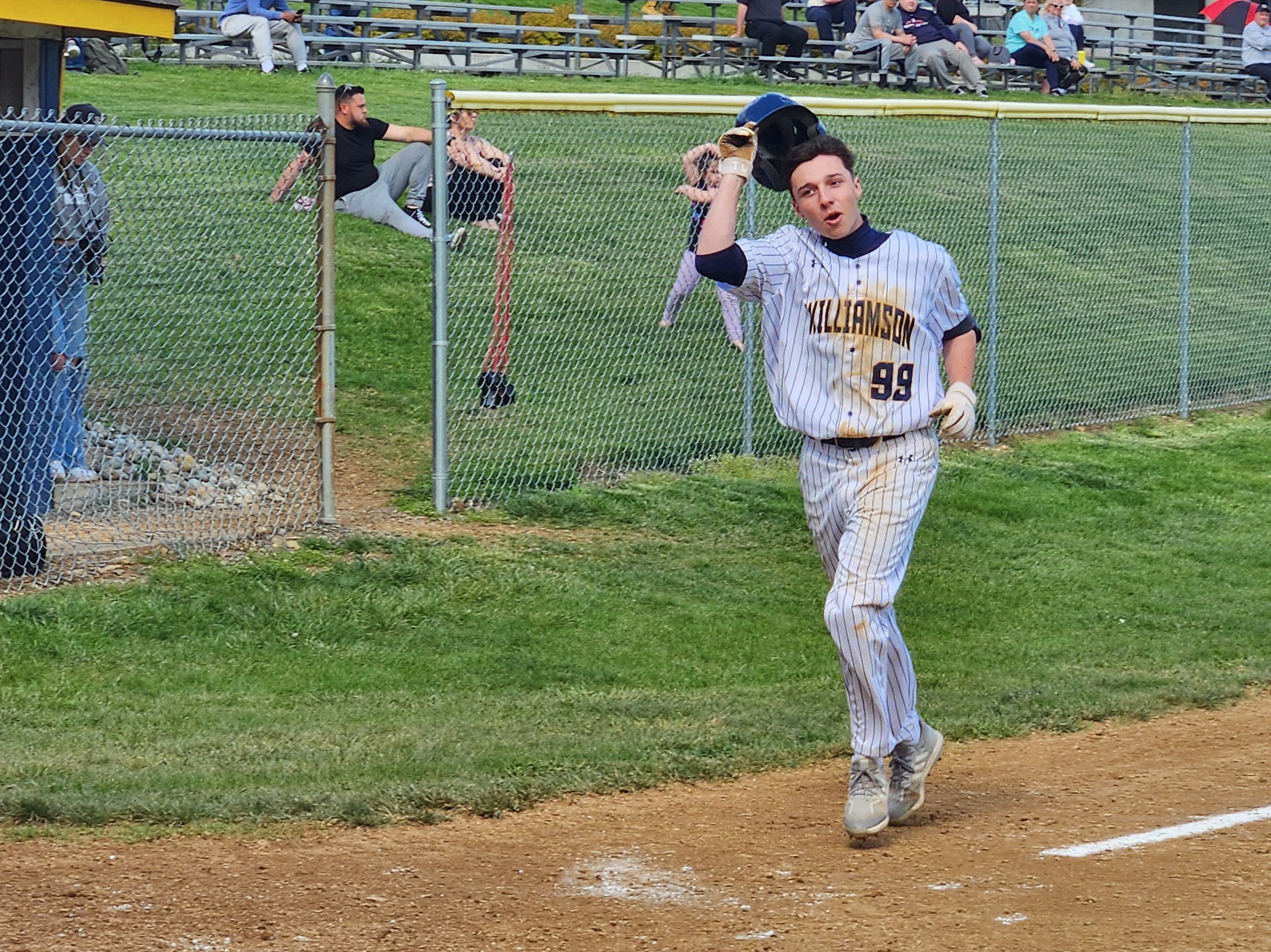 Jacob Naumann heads for home after banging out a home run in Williamson's 19-3 second game win over Patrick Henry